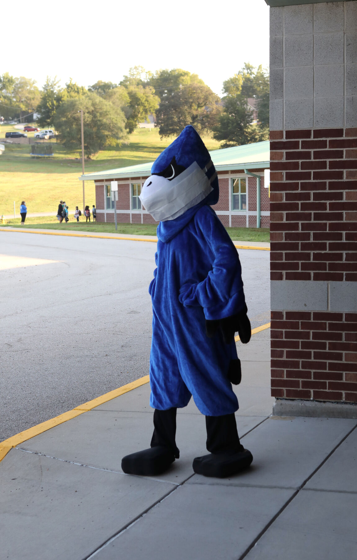 Bluejay mascot wears a face covering